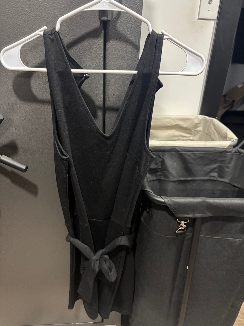 Black womens short one piece with tie around waste.